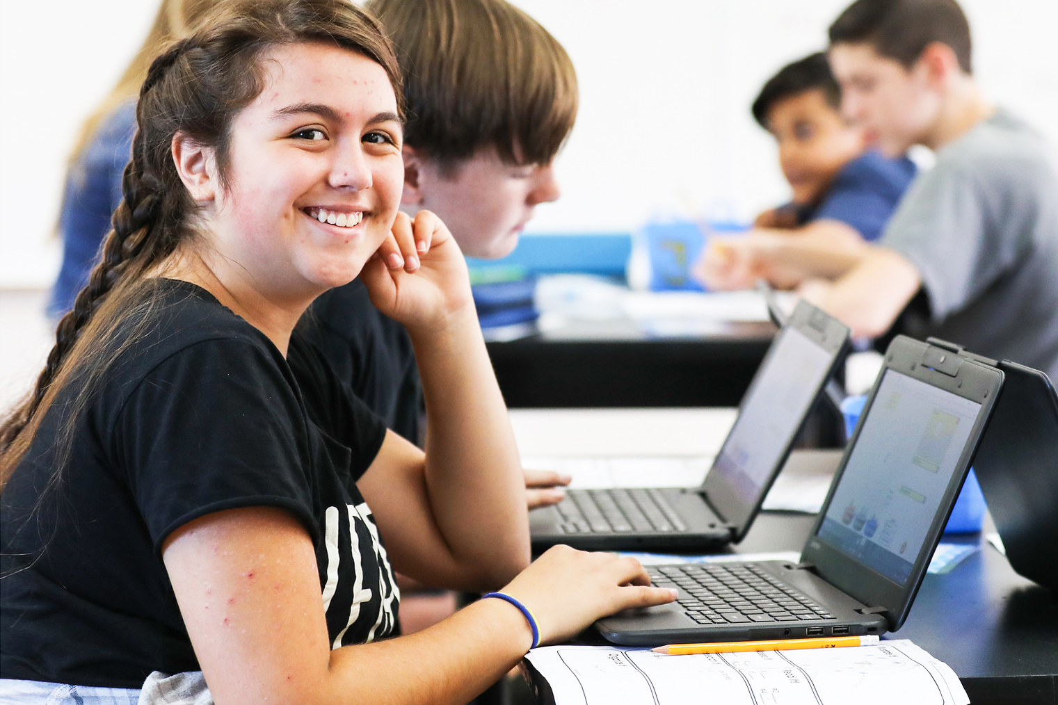 Young girl working on a computer for online program at Compass Charter Schools