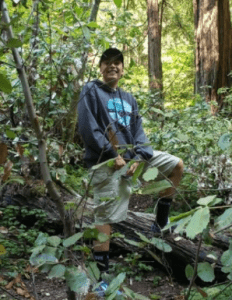 A high school AVID scholar from Compass Online in California smiles with confidence in a serene frosted setting.