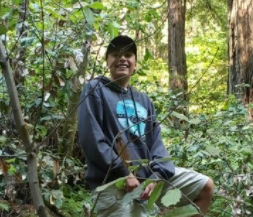 A high school AVID scholar from Compass Online in California smiles with confidence in a serene frosted setting.